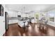 Eat in kitchen with white cabinetry, granite countertops, stainless steel appliances and a center island at 5950 Hidden Ridge Ct, Cumming, GA 30028