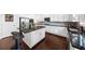 Stylish kitchen with stainless steel appliances, granite countertops, and center island seating at 5950 Hidden Ridge Ct, Cumming, GA 30028