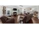 Cozy living room featuring a fireplace, hardwood floors, and comfortable seating arrangements at 5950 Hidden Ridge Ct, Cumming, GA 30028
