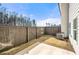 Private backyard featuring a concrete patio and a wood fence, perfect for outdoor entertaining at 6372 Rosetta Sw Dr, Atlanta, GA 30331