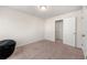 Bedroom with carpet, lots of light, and an open door that leads to another room at 6372 Rosetta Sw Dr, Atlanta, GA 30331
