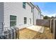 A view of the rear exterior featuring a small fenced yard and concrete patio at 6372 Rosetta Sw Dr, Atlanta, GA 30331