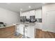 Eat-in kitchen island with white cabinets, and stainless steel appliances at 6372 Rosetta Sw Dr, Atlanta, GA 30331