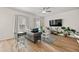 Bright living room features hardwood floors, neutral paint, and a ceiling fan at 6372 Rosetta Sw Dr, Atlanta, GA 30331