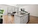 Stylish floor plan with kitchen island, living room, and hardwood floors at 6372 Rosetta Sw Dr, Atlanta, GA 30331