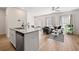 Inviting open floor plan with kitchen island, dining area, and living space at 6372 Rosetta Sw Dr, Atlanta, GA 30331