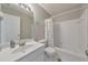 Clean, white bathroom featuring a shower-tub combination and a vanity with a sink at 1703 Bentridge Nw Dr, Kennesaw, GA 30144