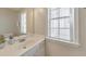 Well-lit bathroom with a vanity, sink, and ample natural light from the window at 1703 Bentridge Nw Dr, Kennesaw, GA 30144