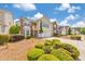 Exterior image of a home featuring manicured landscaping, a two-car garage, and a welcoming front entrance at 1703 Bentridge Nw Dr, Kennesaw, GA 30144