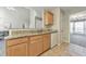 Open-concept kitchen features granite counters, wood cabinets, and views into living area at 1703 Bentridge Nw Dr, Kennesaw, GA 30144