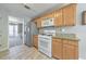 Well-maintained kitchen featuring wooden cabinets, granite countertops, and stainless steel appliances at 1703 Bentridge Nw Dr, Kennesaw, GA 30144