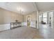 Cozy living room with carpet flooring, neutral walls, and an open doorway to the adjacent kitchen at 1703 Bentridge Nw Dr, Kennesaw, GA 30144