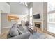 Spacious living area features a fireplace and seamless flow to the kitchen at 1703 Bentridge Nw Dr, Kennesaw, GA 30144