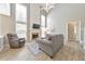 Bright living room with soaring ceilings, fireplace, and wood-look floors at 1703 Bentridge Nw Dr, Kennesaw, GA 30144