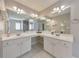 Elegant main bathroom features dual sinks and large mirrors at 1703 Bentridge Nw Dr, Kennesaw, GA 30144