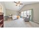 Cozy main bedroom featuring a vaulted ceiling and comfortable sitting area at 1703 Bentridge Nw Dr, Kennesaw, GA 30144