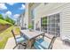Outdoor patio with a table and chairs, ideal for dining and relaxation at 1703 Bentridge Nw Dr, Kennesaw, GA 30144