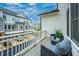 Enjoy outdoor living on this balcony with comfortable seating and views of the surrounding neighborhood and the nearby garages at 2062 Cortland Rd, Milton, GA 30009