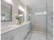 Elegant bathroom featuring double sinks, quartz countertops, and a luxurious glass-enclosed shower at 2062 Cortland Rd, Milton, GA 30009