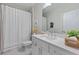 Pristine bathroom features white cabinetry, sleek countertops, and a shower for a spa-like experience at 2062 Cortland Rd, Milton, GA 30009