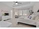 Inviting bedroom features a tray ceiling, accent wall decor, and views of the surrounding neighborhood at 2062 Cortland Rd, Milton, GA 30009