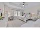 Stylish bedroom with a ceiling fan, work area, and a large bed at 2062 Cortland Rd, Milton, GA 30009