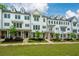 Charming townhomes, boasting landscaped lawns and inviting entrances, create a picturesque street view at 2062 Cortland Rd, Milton, GA 30009