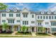 Charming townhome showcases a neat front yard, offering delightful curb appeal and landscaped walkway at 2062 Cortland Rd, Milton, GA 30009