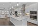 Modern kitchen with a view into the open living room space with fireplace at 2062 Cortland Rd, Milton, GA 30009