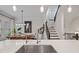 Open concept kitchen with a sink overlooking dining and stairwell at 2062 Cortland Rd, Milton, GA 30009