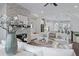 Open-concept living space with fireplace and modern decor flowing into the kitchen at 2062 Cortland Rd, Milton, GA 30009