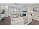 Bright living room with fireplace, large windows, and modern, white decor at 2062 Cortland Rd, Milton, GA 30009