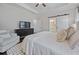 Bright main bedroom suite with a king size bed and seating area at 2062 Cortland Rd, Milton, GA 30009