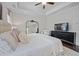 Spacious main bedroom featuring a plush king-sized bed, seating area, and a large mirror at 2062 Cortland Rd, Milton, GA 30009