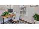 Comfortable office area featuring a desk with a natural wood top, neutral color scheme, and plants at 2062 Cortland Rd, Milton, GA 30009