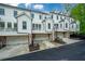 Rear view of townhomes with garages and balconies; showing architectural design and layout at 2062 Cortland Rd, Milton, GA 30009
