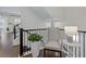 Elegant staircase landing boasts stylish decor, providing an inviting transition between floors in the home at 2062 Cortland Rd, Milton, GA 30009