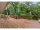 Expansive outdoor deck with wood flooring overlooking lush greenery, perfect for relaxation and social gatherings at 2337 Elmwood Se Cir, Atlanta, GA 30339