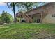 Backyard featuring an elevated deck with stairs, covered patio, and a well-maintained lawn for outdoor enjoyment at 2337 Elmwood Se Cir, Atlanta, GA 30339
