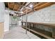 Spacious basement with block walls, exposed ceiling, and workbench, ready to be finished with new flooring and paint at 2337 Elmwood Se Cir, Atlanta, GA 30339