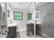 Well-lit bathroom with a modern vanity and glass-enclosed shower at 2337 Elmwood Se Cir, Atlanta, GA 30339