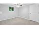 Neutrally painted bedroom with new carpet flooring, ceiling fan and natural light, perfect for relaxation and rest at 2337 Elmwood Se Cir, Atlanta, GA 30339