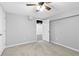 Bright bedroom with a ceiling fan, neutral walls, and gray carpeting, offering a serene retreat at 2337 Elmwood Se Cir, Atlanta, GA 30339