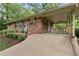 Quaint carport with a cozy outdoor deck area and decorative wrought iron details at 2337 Elmwood Se Cir, Atlanta, GA 30339