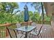 Outdoor deck area with patio table and chairs, perfect for outdoor entertaining overlooking lush greenery at 2337 Elmwood Se Cir, Atlanta, GA 30339