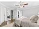 Spacious bedroom featuring a large bed, soft rug, and ensuite bathroom at 2337 Elmwood Se Cir, Atlanta, GA 30339