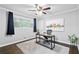 Comfortable home office with natural light, modern desk, and hardwood floors at 2337 Elmwood Se Cir, Atlanta, GA 30339