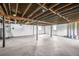 Unfinished basement with exposed rafters and whitewashed walls at 2529 Ryne St, Atlanta, GA 30318