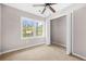 Bright bedroom with plush carpeting, closet, and natural light at 2529 Ryne St, Atlanta, GA 30318