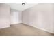 This bedroom has neutral walls and carpet and a flush mount ceiling light at 2529 Ryne St, Atlanta, GA 30318